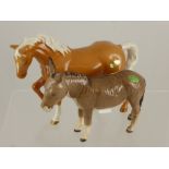 A Beswick Figure of a Palomino Horse (left foot up) together with a donkey