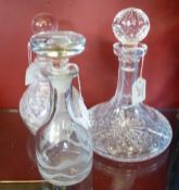 A Cut Glass Ship Decanter together with a Stewart crystal decanter and a third decanter of