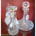 A Cut Glass Ship Decanter together with a Stewart crystal decanter and a third decanter of