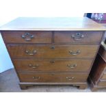 An Antique Oak Chest of Drawers, with two short drawers and three long drawers, supported on bracket