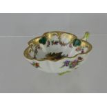 A 19th Century Meissen Punch Cup depicting classical figures to the bowl and floral spray.