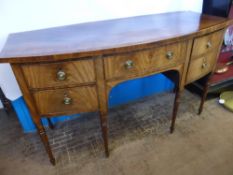 A Georgian Mahogany Bow Fronted Sideboard, the sideboard having a central drawer flanked by two