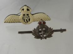 An Ivory RAF Badge, together with silver metal naval coronet badge.