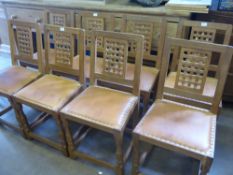 Sid Pollard Set of Eight Oak Dining Chairs, with the back of the seat carved to look like lattice