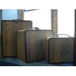 A Collection of Three Vintage graduated Revelation Canvas Suitcases, some with Pan Am transit