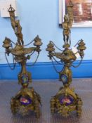 A Pair of circa 1900 Brass Garnitures, the garnitures having porcelain dome base, shield design