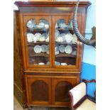 An Antique Mahogany Corner Display Cabinet. The cabinet having three shelves with shaped, glazed