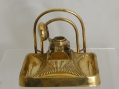 An Art Deco Brass and Cut Glass Ink Well and Letter Stand, the stand engraved and dated 1922.