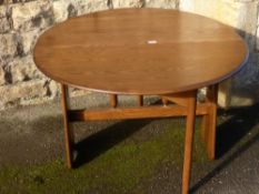 An Ercol Elm Drop Leaf Table, approx 120 x 107 x 73 cms.