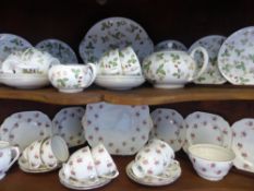 A Part Wedgwood Wild Strawberry Tea Set, comprising tea pot, milk jug, sugar bowl, six cups, six