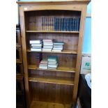 A Contemporary Pine Book Case with four shelves.