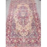 An Antique Isfahan Rug circa 1900, measuring 230 x 142 cms.