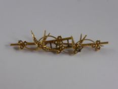 An Edwardian 15 ct Gold and Seed Pearl Sweet Heart Brooch, in the form of two swallows.Approx 5.