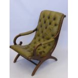 A Late Victorian Slipper Chair with leather upholstery.