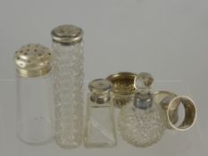 A Miscellaneous Collection of four Cut Glass and other perfume bottles together with two solid