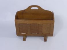Sid Pollard Oak Magazine Rack, of crib form with adzed panelled sides and a central handle.