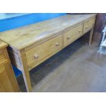 A Traditional Antique Pine Dresser Base, three drawers on straight legs, approx 230 x 62 x 90 cms