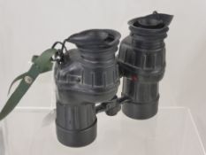 A Pair of Newey Marine Rubber Clad Binoculars with spare tinted lenses.