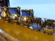 Five Graduated Lustre-Ware Jugs. (5)