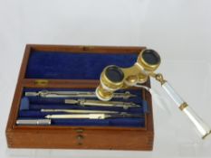 A Pair of Antique Continental Mother of Pearl Opera Glasses together with a box of writing