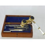 A Pair of Antique Continental Mother of Pearl Opera Glasses together with a box of writing