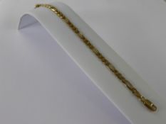 A 9 ct Gold Curve Linked Necklace, approx 57 cms, together with a 9 ct bracelet 18 cms, approx