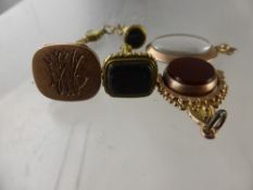 Two Antique 9 ct Gold Seal Fobs, one bloodstone, the other having a locket front, together with