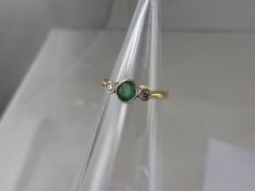 A Lady's 18 ct Diamond and Emerald Ring, size I, approx wt 1.9 gms.
