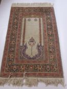 A Fine Wool Persian Prayer Rug, the rug having temple design to cream centre panel with bird to