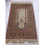 A Fine Wool Persian Prayer Rug, the rug having temple design to cream centre panel with bird to