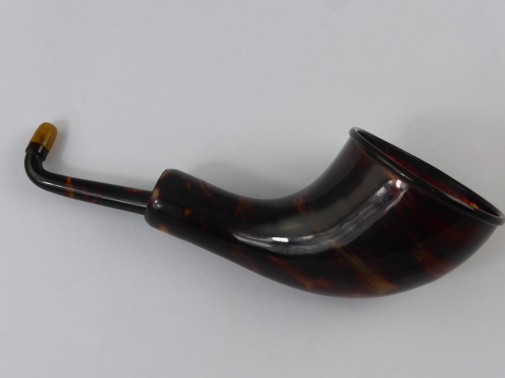 An Antique Tortoise Shell Effect Hearing Aid.