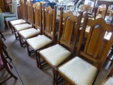 Seven Quality Bespoke Oak Dining Room Chairs and Carver. The chair backs of Gothic design with