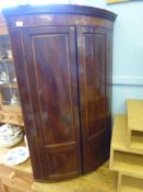 An Antique Mahogany and Satin Wood Inlay Three Shelf Corner Cabinet. The cabinet having key style