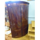 An Antique Mahogany and Satin Wood Inlay Three Shelf Corner Cabinet. The cabinet having key style