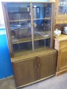 An Ercol Elm Glazed Front Display Cabinet, the cabinet having two shelves with cupboard below,