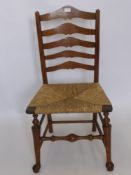 A Single Antique Rattan Seated Ladder Back Chair, the chair having turned stretcher with hoof pad