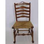 A Single Antique Rattan Seated Ladder Back Chair, the chair having turned stretcher with hoof pad