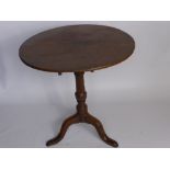 An Antique Oak Kitchen Table, turned column on splayed feet.