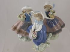 Three Porcelain Lladro Figurines, depicting little girls with baskets of flowers, approx 17cms high.