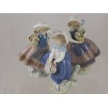 Three Porcelain Lladro Figurines, depicting little girls with baskets of flowers, approx 17cms high.