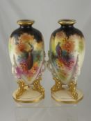 A Pair of Edwardian Vases depicting pheasants and peacocks. (2)