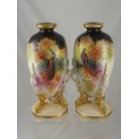 A Pair of Edwardian Vases depicting pheasants and peacocks. (2)