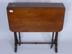 An Antique Mahogany Sutherland Drop Leaf Table, on turned legs approx 80 x 68 x 66 cms,