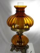 An Amber Glass Oil Lamp, wired for conversion.