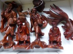 A Collection of Carved Chinese Wooden Figures, including four wise men, two goldfish and duck.