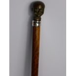 A Rosewood Shafted Walking Cane, with bronze "clowns" head knop, silver band (600) and bone tip,