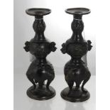 A Pair of Antique Japanese Bronzed Candle Sticks, the candle sticks having three lion mask feet,