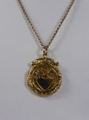 A Gold Locket on a Chain, approx 6 gms.