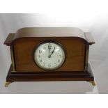A Mahogany Mantel Clock, with brass pillar supports, cream enamel dial.