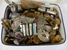 A Tin Containing a Collection of Militaria Insignia, cap badges, buttons etc. (approx 200 items).